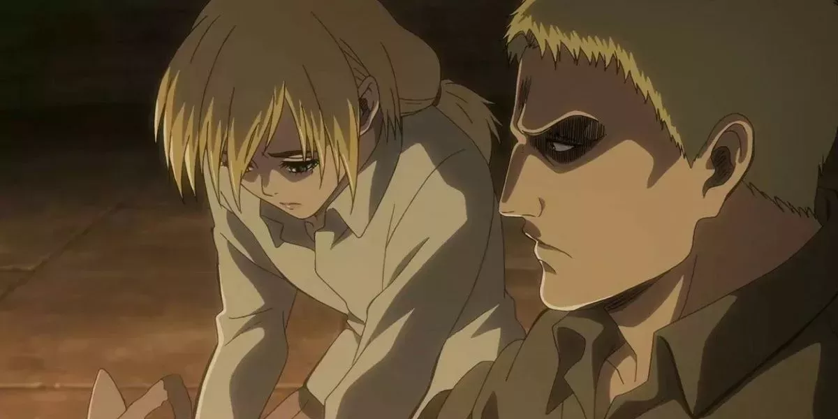 Reiner looking coldly over at Historia from Attack On Titan.