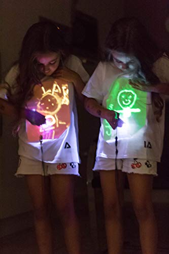 Illuminated Apparel Camiseta con diseño Interactivo con luz Que Brilla en la Oscuridad (Blanco/Rosa, 9-11 Años)