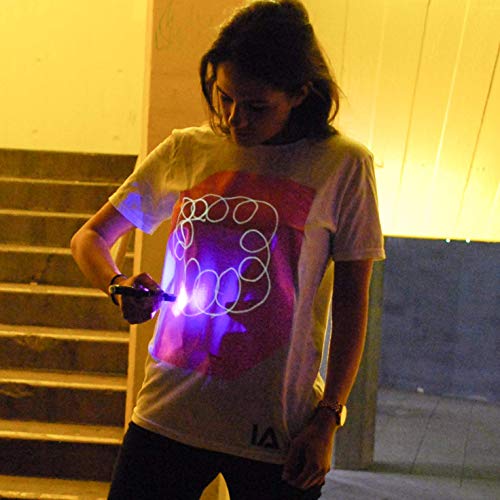 Illuminated Apparel Camiseta con diseño Interactivo con luz Que Brilla en la Oscuridad (Blanco/Rosa, 9-11 Años)