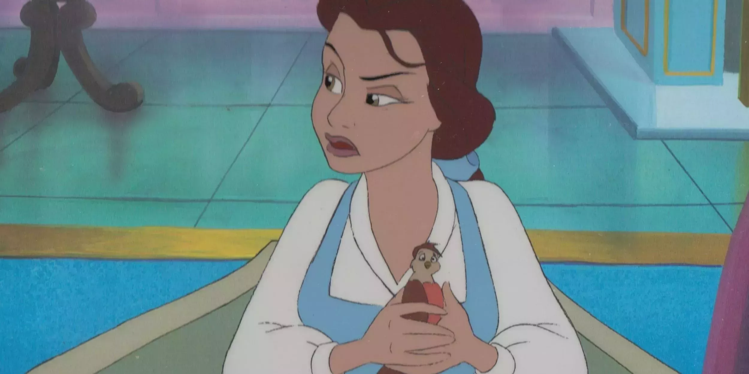 Belle holds the injured bird she found - Belle's Magical World