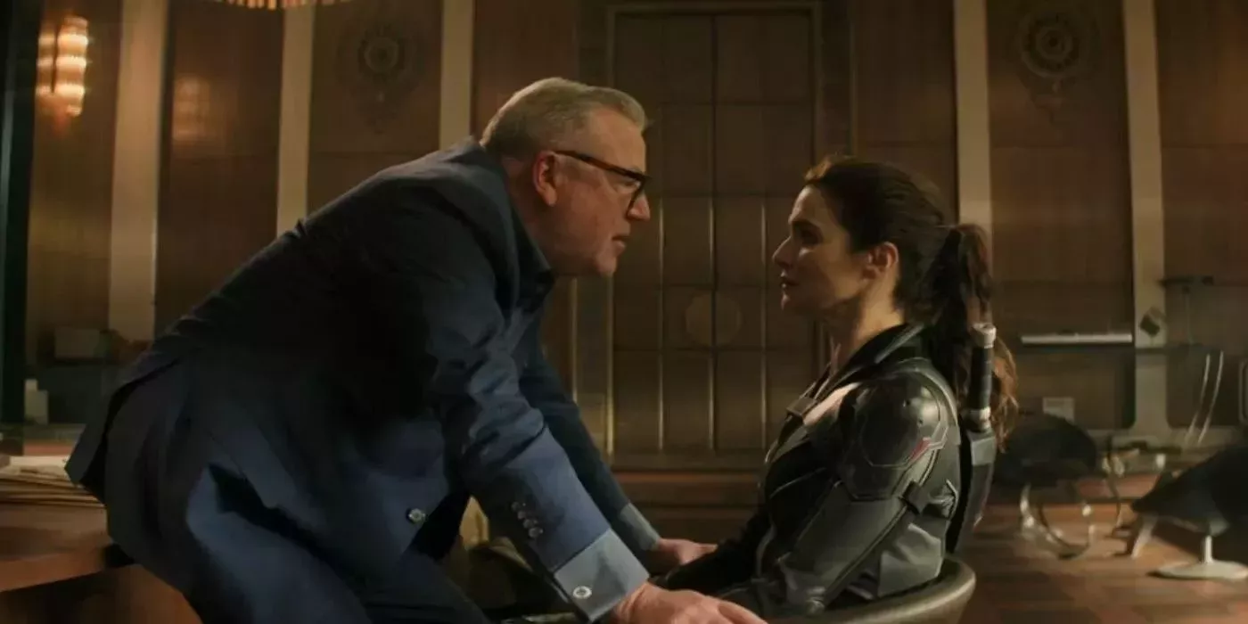 general dreykov leans threateningly close to melina vostokoff