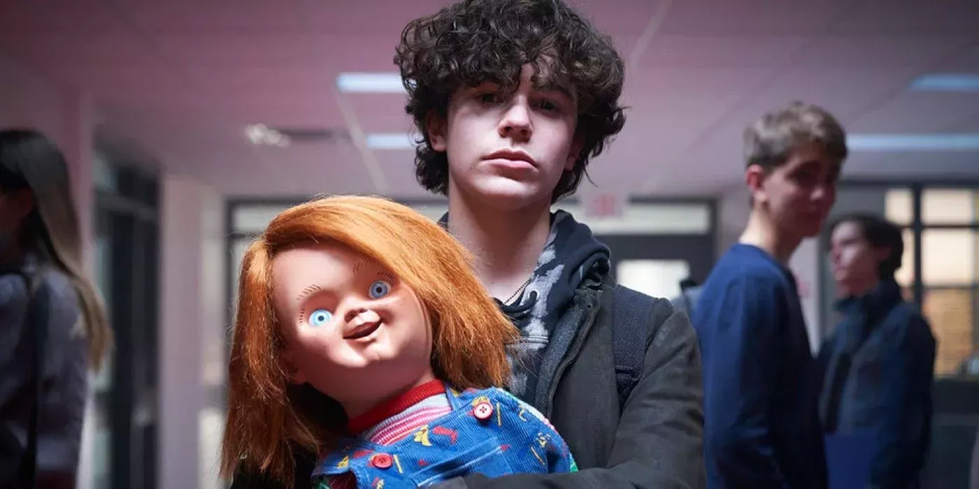 Zackary Arthur holds Chucky at school in Chucky tv series.