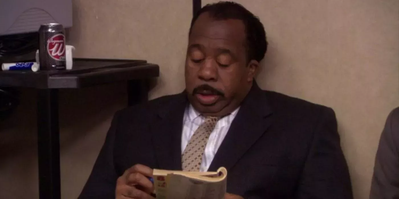 Stanley Hudson in The Office, doing a crossword