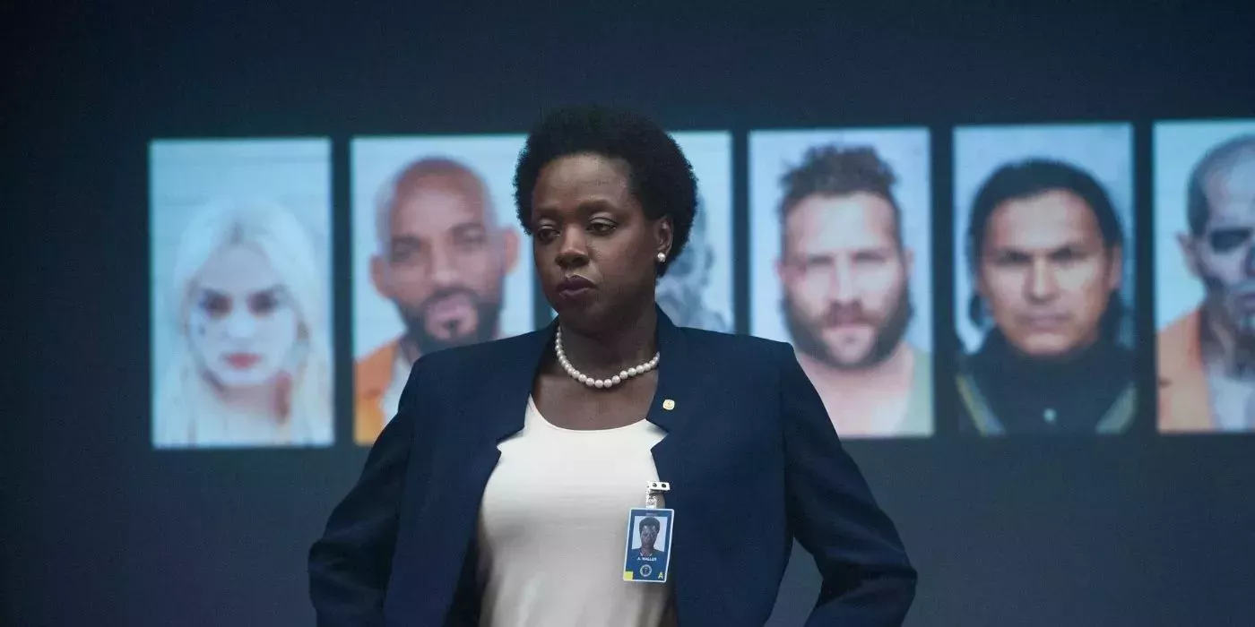 Viola Davis in the role of Amanda Waller, standing in front of a projected image on the wall