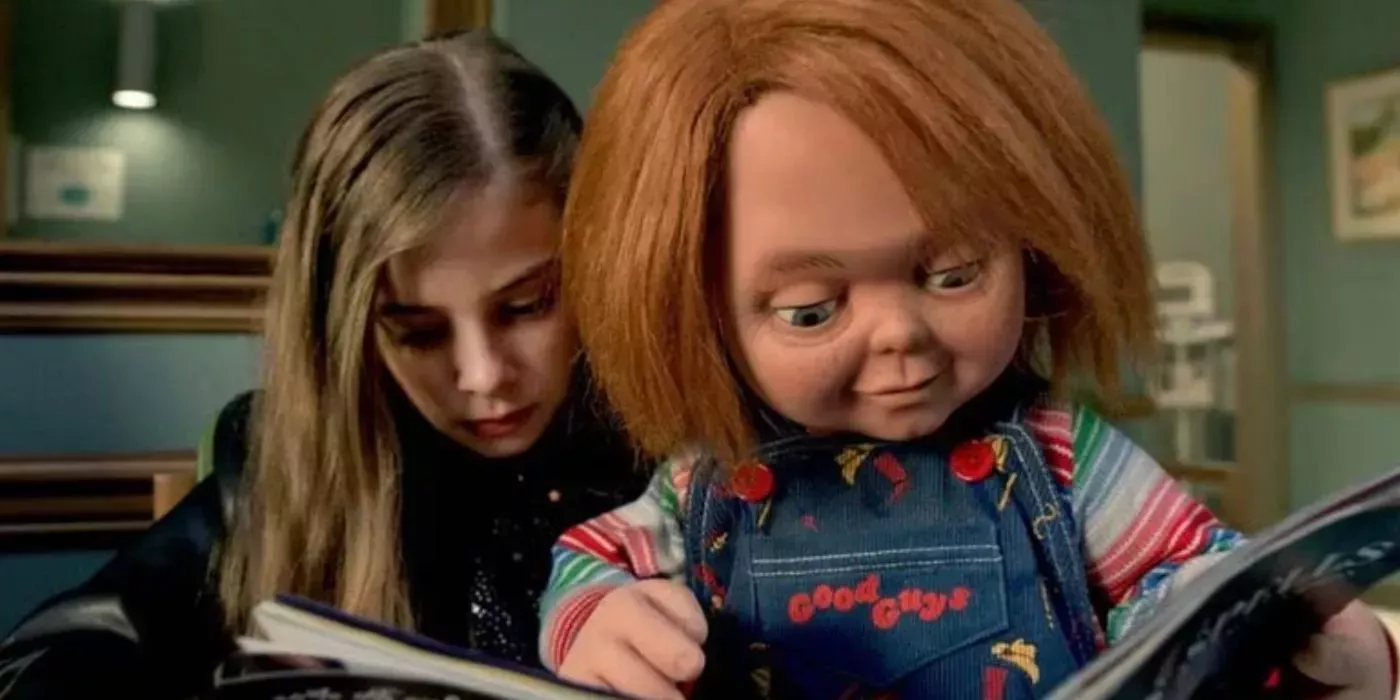 Chucky: Caroline holding Chucky while he reads from a magazine