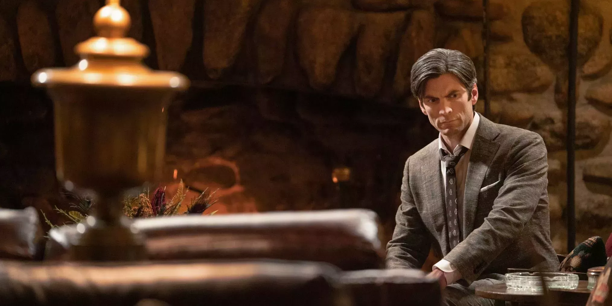 Yellowstone's Jamie Dutton (played by Wes Bentley) sits in front of a fireplace