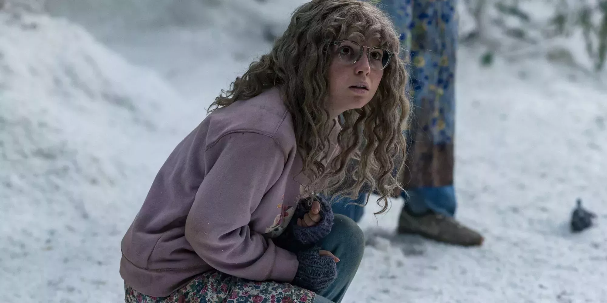 Misty crouching in the snow in Yellowjackets.