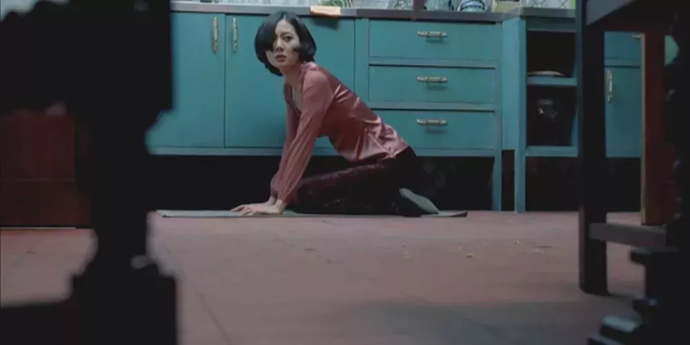 Eun-joo senses a sinister presence in the kitchen in A Tale Of Two Sisters Jump Scare