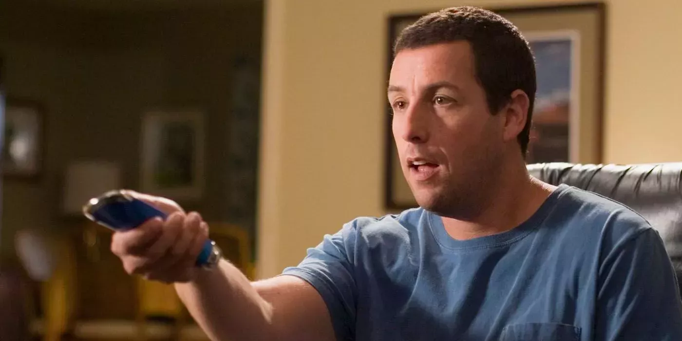 Adam Sandler using his remote in Click