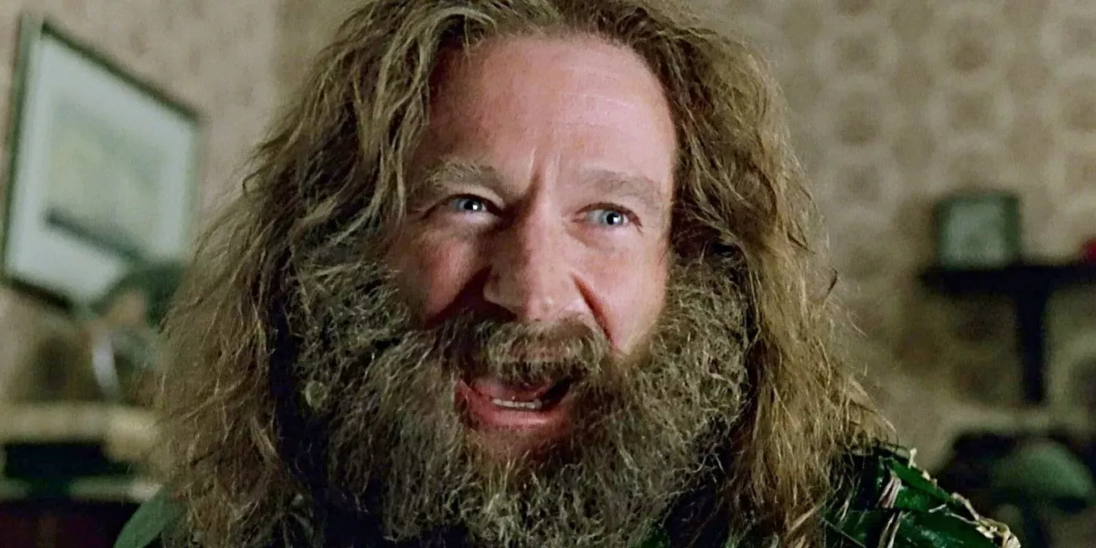Robin Williams laughing as Alan Parrish in the original Jumanji movie