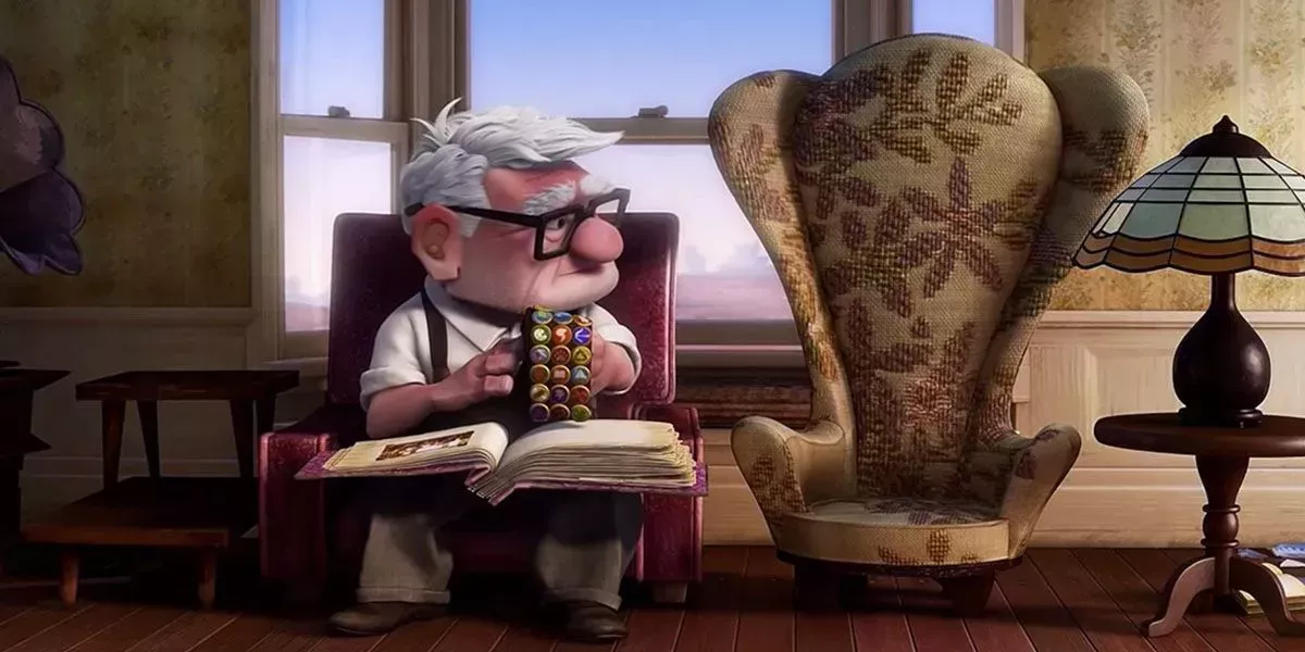 Carl Fredricksen looks sadly at Ellie’s Empty Chair. 