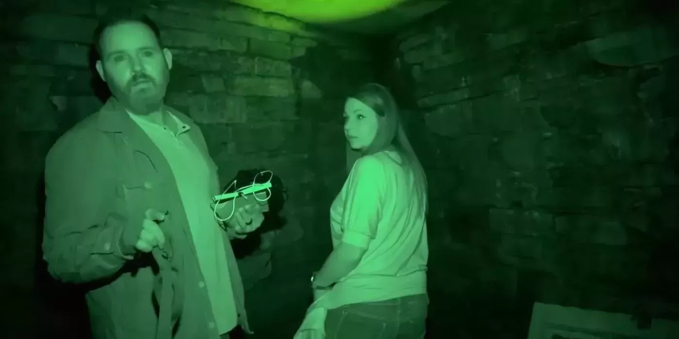 Scene from an investigation in 28 Days Haunted sees man and woman with nighttime camera footage