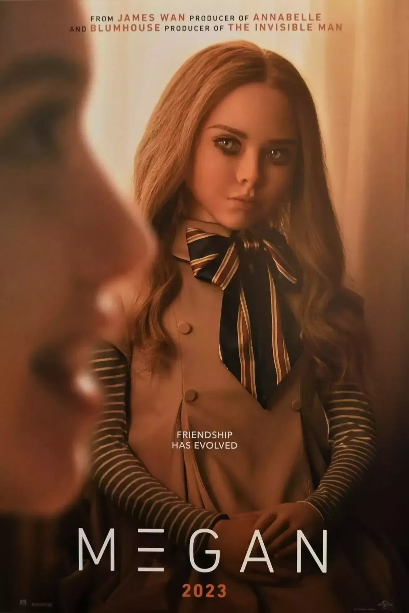 M3GAN watches a young girl talking on the M3GAN movie poster