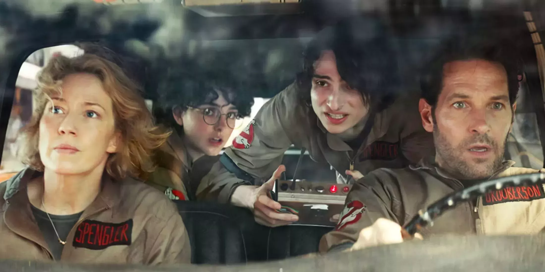 The Spenglers driving through NYC in the Ghostbusters iconic car