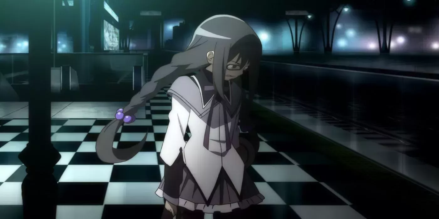 Homura looking down, crying and clenching her fists from Puella Magi Madoka Magica.