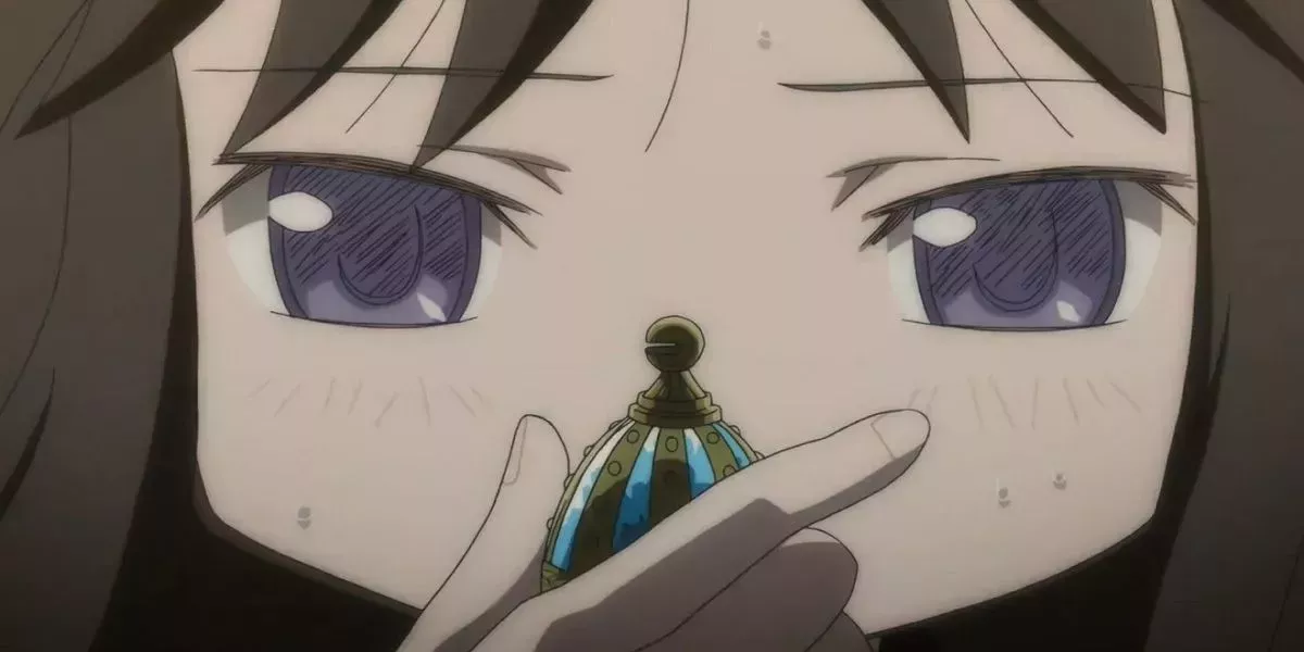 Homura holding Sayaka's soul gem from Puella Magi Madoka Magica.