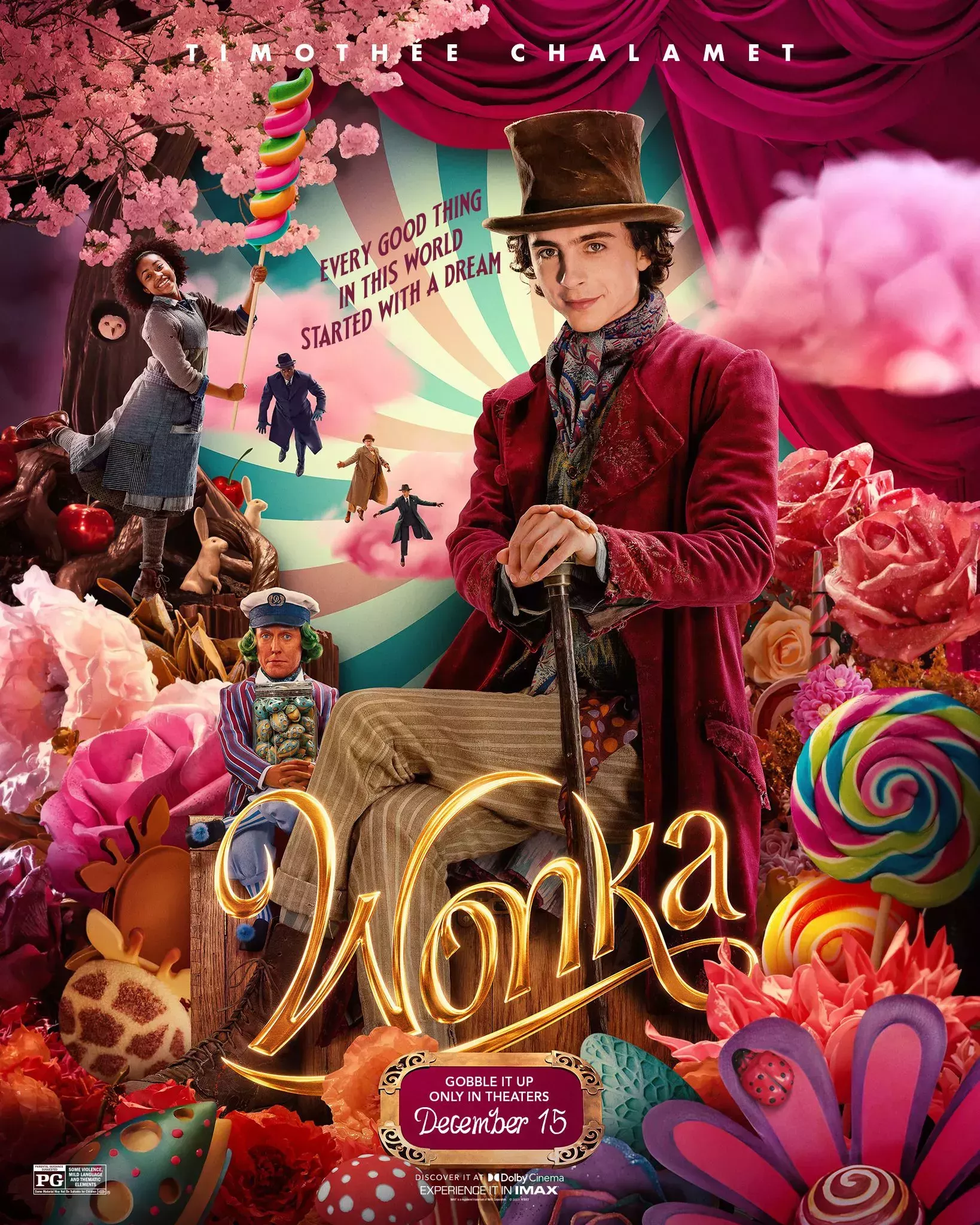 Wonka sits among all kinds of colorful giant candies and chocolate on the Wonka Film Poster
