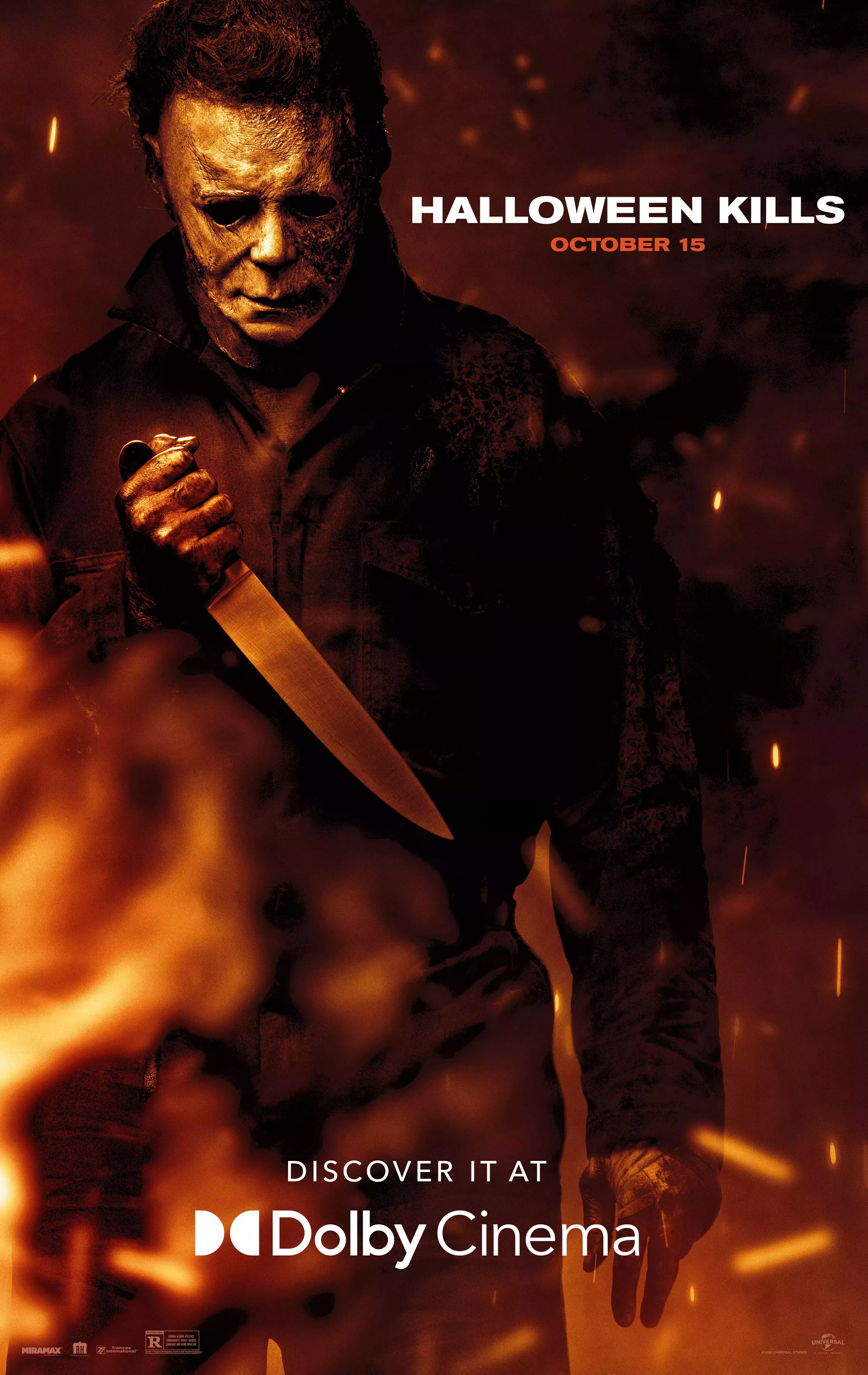 Michael Myers holds a knife while surrounded by fire on the Halloween Kills Dolby Cinema Poster