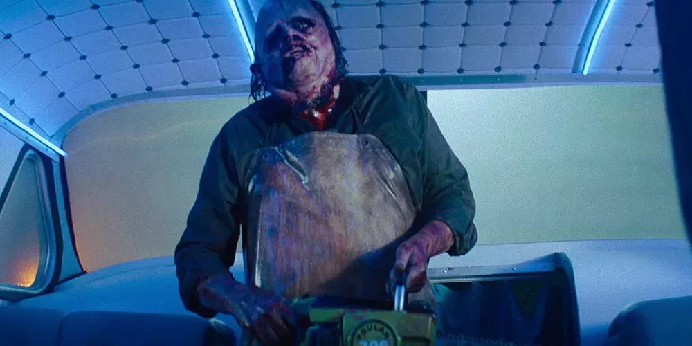 Leatherface revs up his chainsaw in Texas Chainsaw Massacre.