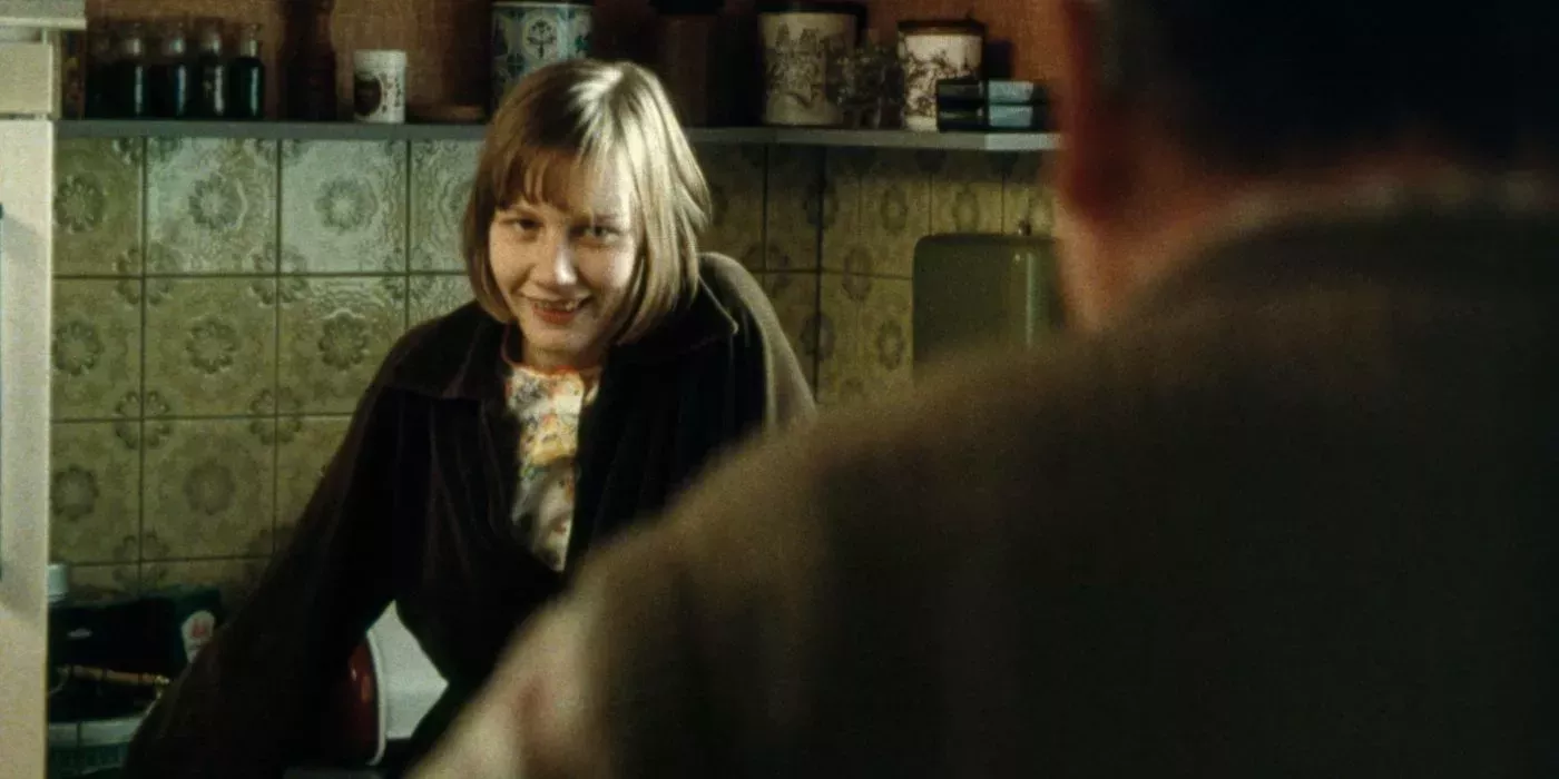 Michaela stares at her father in Requiem 