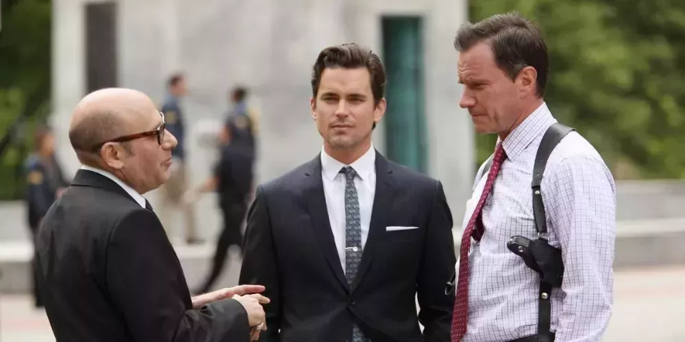  Neal Caffrey, Mozzie and Peter Burke talking outside in White Collar
