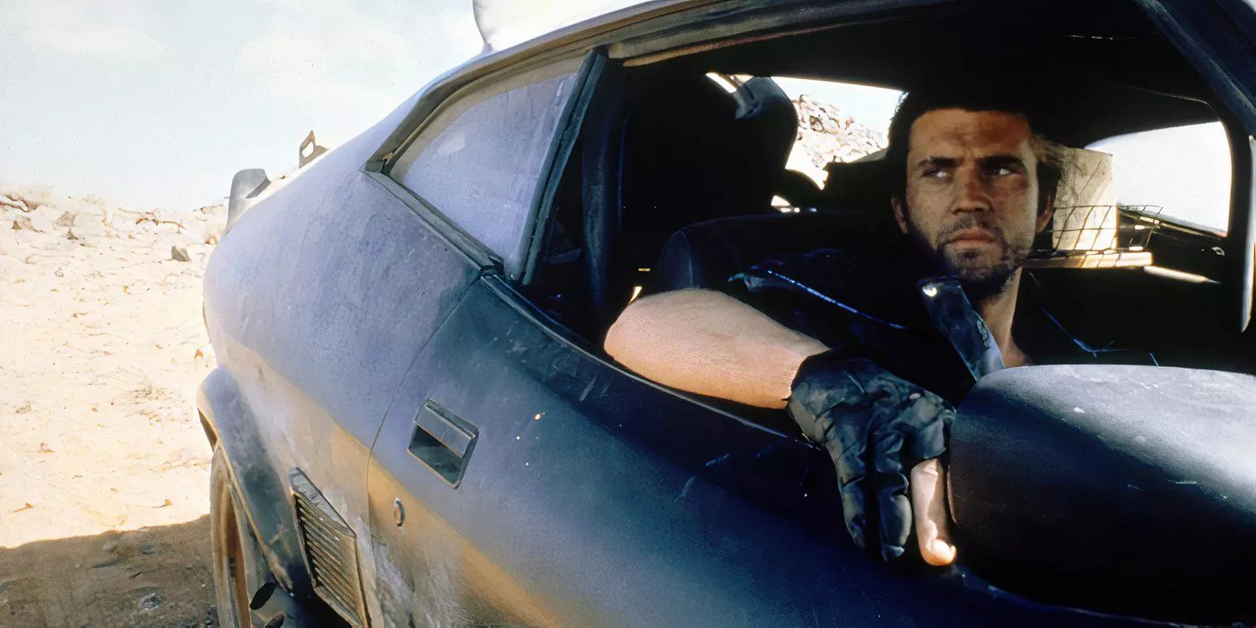 Mel Gibson as Mad Max getting ready to drive past the Humungus gang in his repaired vehicle in Mad Max 2: The Road Warrior.