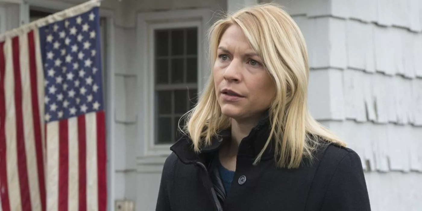 Carrie stands by a U.S. flag in Homeland