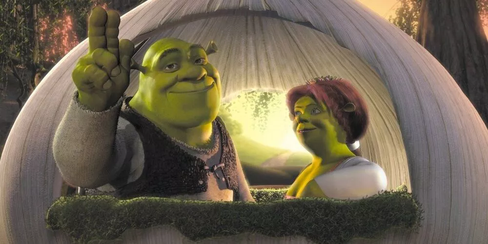 Shrek and Fiona ride in the onion carriage after their wedding in Shrek