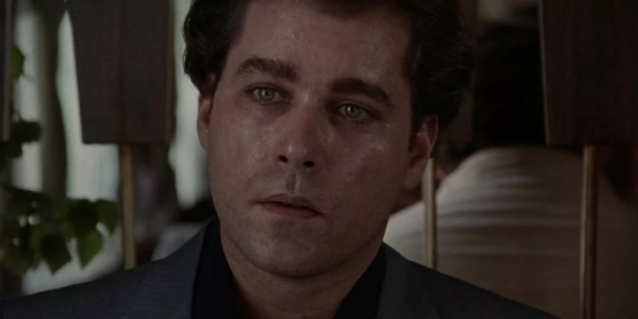 Freeze frame of Henry Hill realizing James Conway's intentions at a diner in Goodfellas