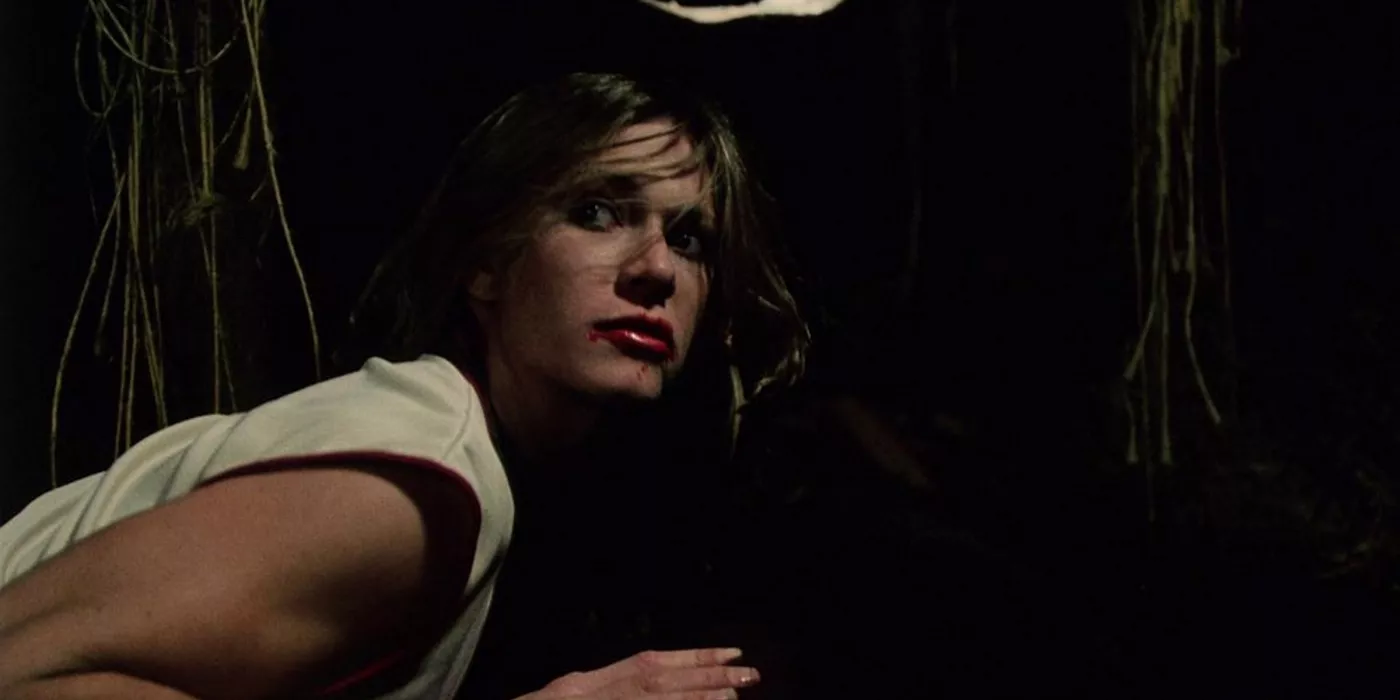 A woman crouches in Rabid