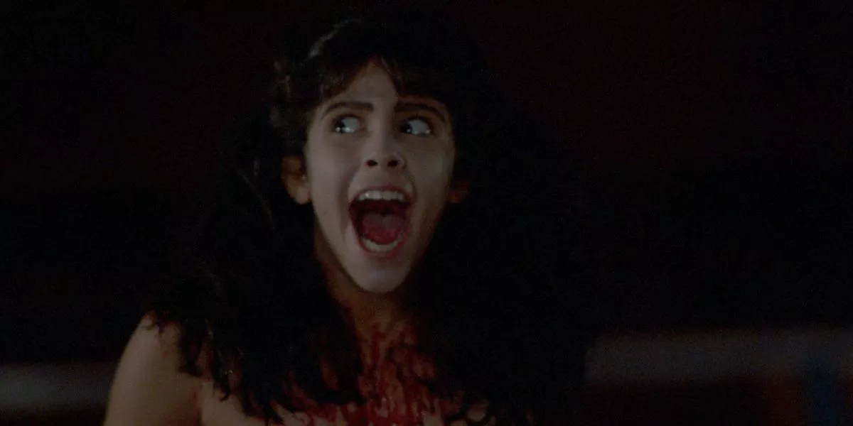 Angela with her mouth wide open at the end of Sleepaway Camp.