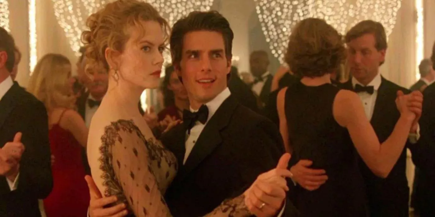 Nicole Kidman and Tom Cruise dance at a formal affair in Eyes Wide Shut.
