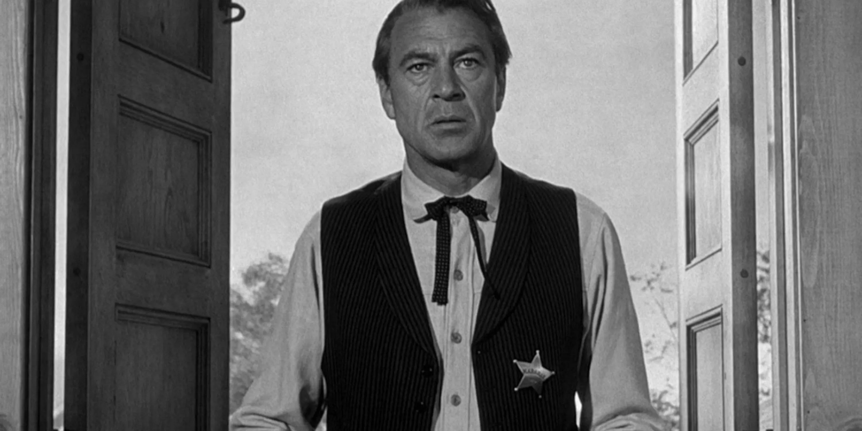 Marshal Will Kane stands in a doorway in High Noon.