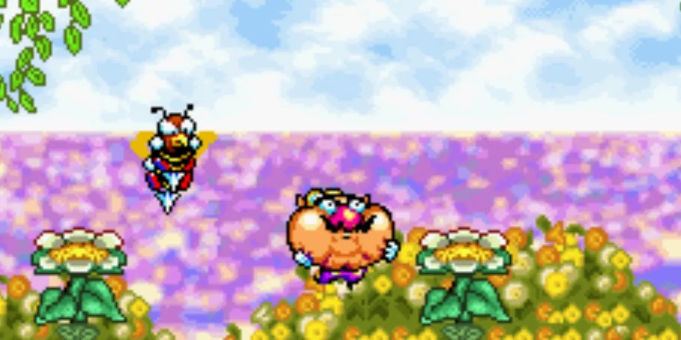 Wario Land 4 gameplay with Wario's face swollen and a bee enemy next to him.