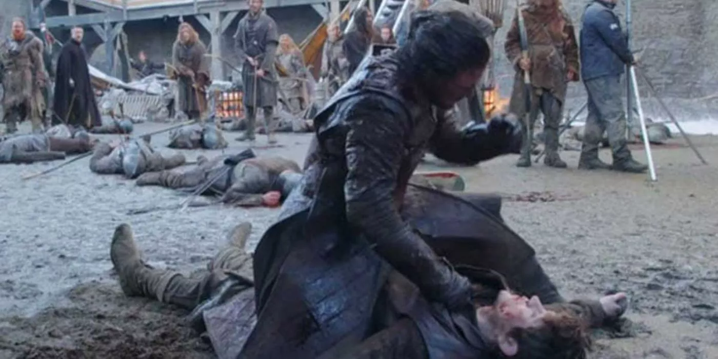 Jon Snow atop Ramsay Bolton and punching him in Game of Thrones.